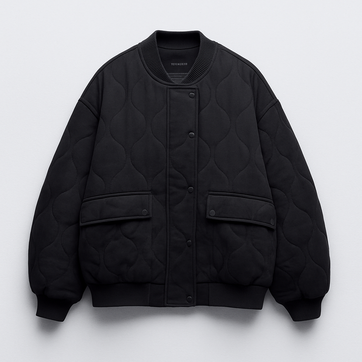 Fashionable women's quilted bomber jacket. Oversized design with practical utility pockets for chic everyday style.