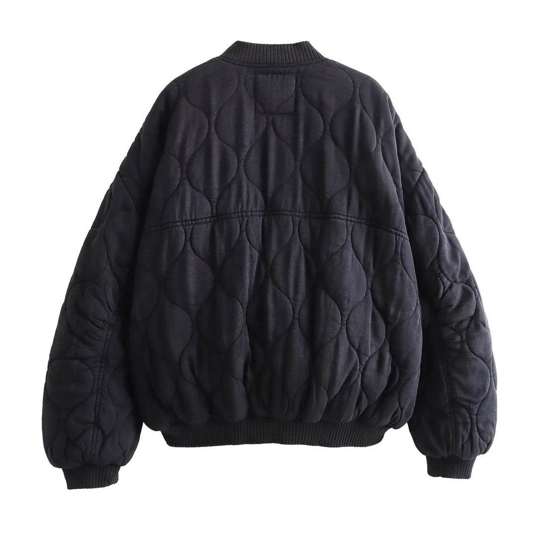 Effortless women's oversized quilted bomber jacket. A stylish and practical outerwear piece for modern women.