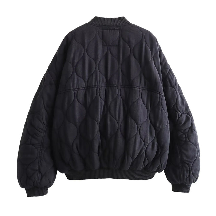 Effortless women's oversized quilted bomber jacket. A stylish and practical outerwear piece for modern women.