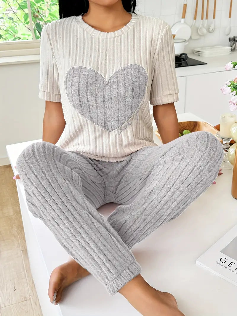 Soft ribbed women's pyjama set with charming heart print. Ideal comfy sleepwear & loungewear.