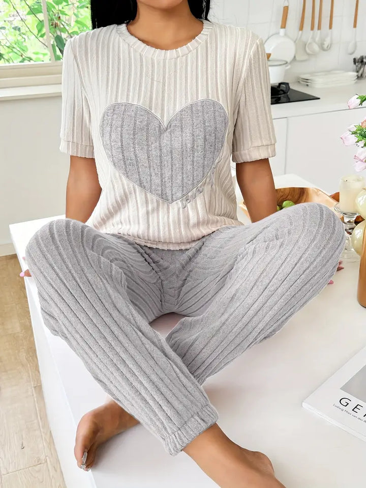 Soft ribbed women's pyjama set with charming heart print. Ideal comfy sleepwear & loungewear.