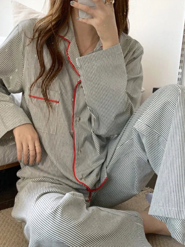 Comfortable women's striped long sleeve pyjama set in light grey, ideal soft sleepwear and loungewear.