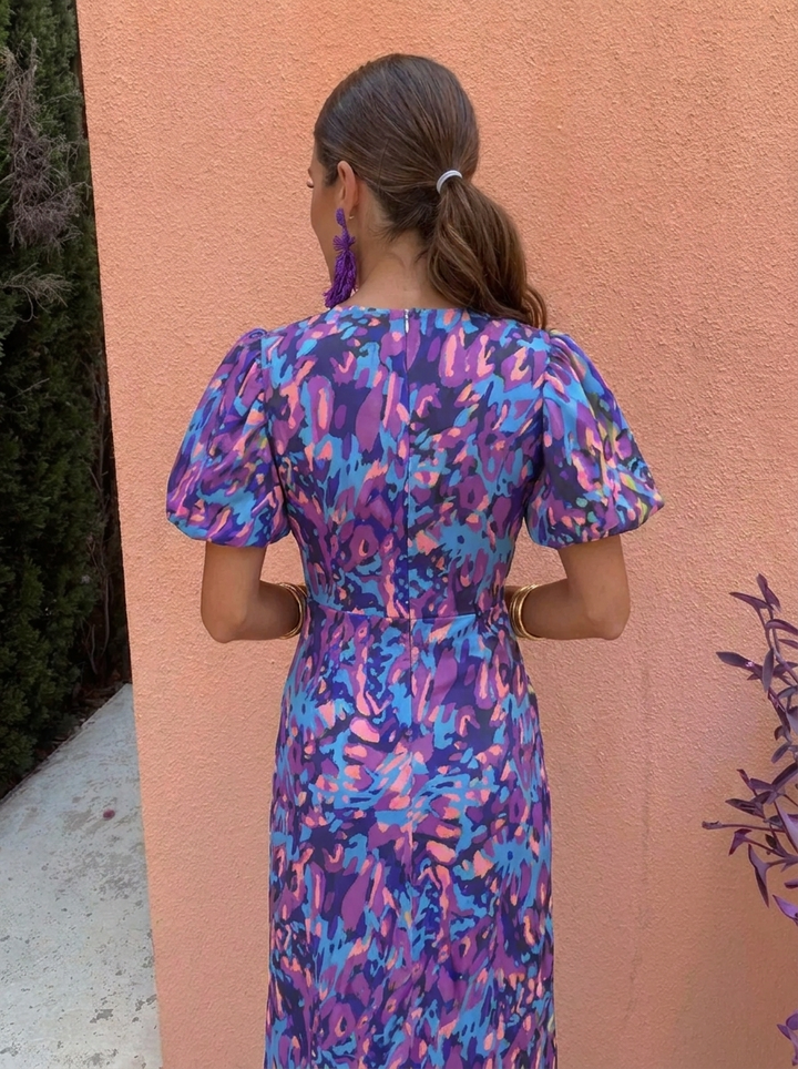 Stylish floral midi race dress with chic puff sleeves and V-neck, great for summer fashion.