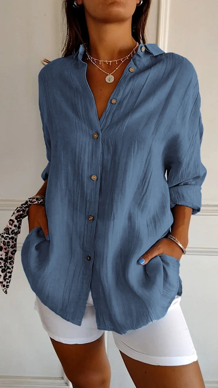 Front view of a womens everyday button-up shirt with long sleeves