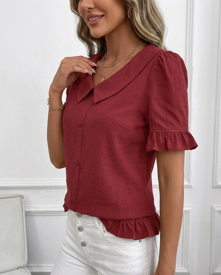 Stylish women's blouse featuring a chic ruffle hem, sophisticated collar, and trendy puff sleeves.