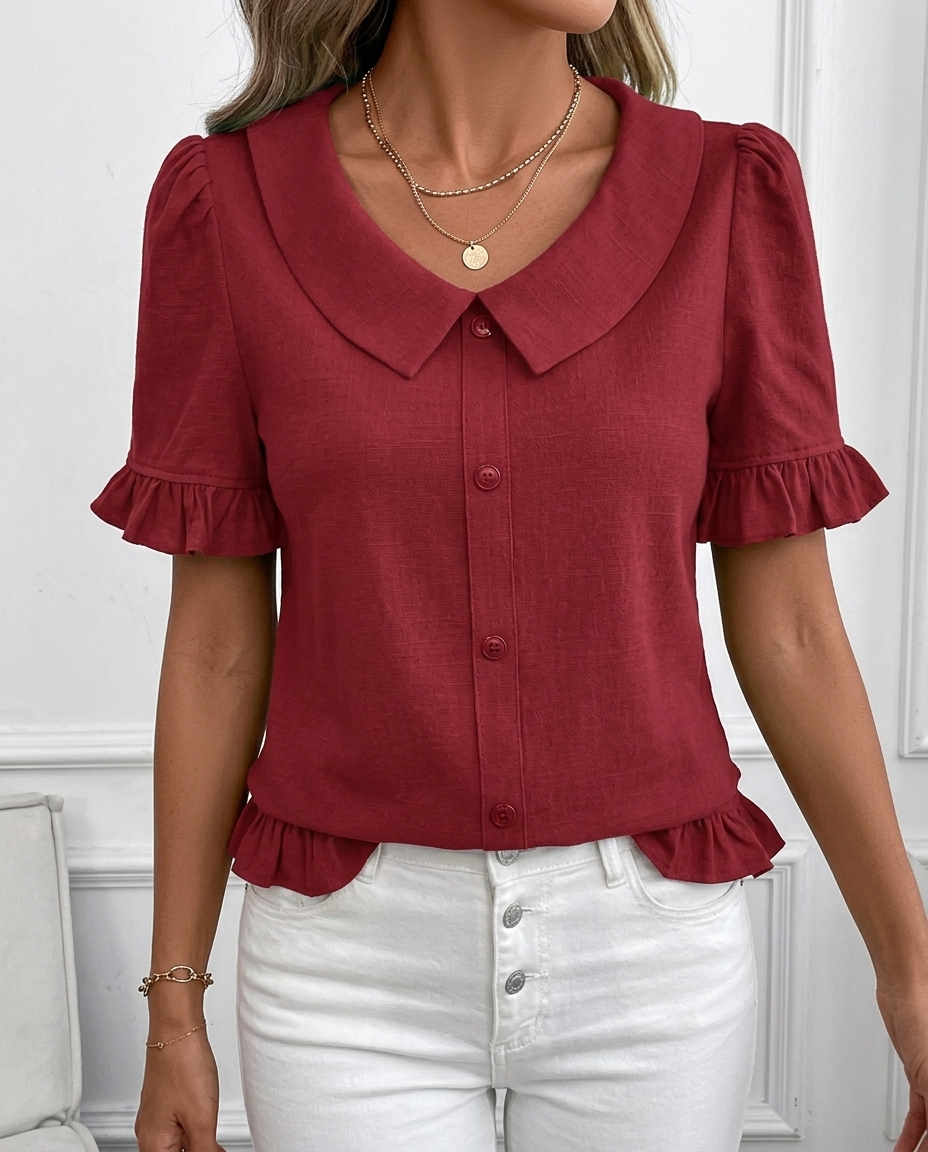Women's elegant ruffle hem blouse with classic collar & button front. Chic puff short sleeves.