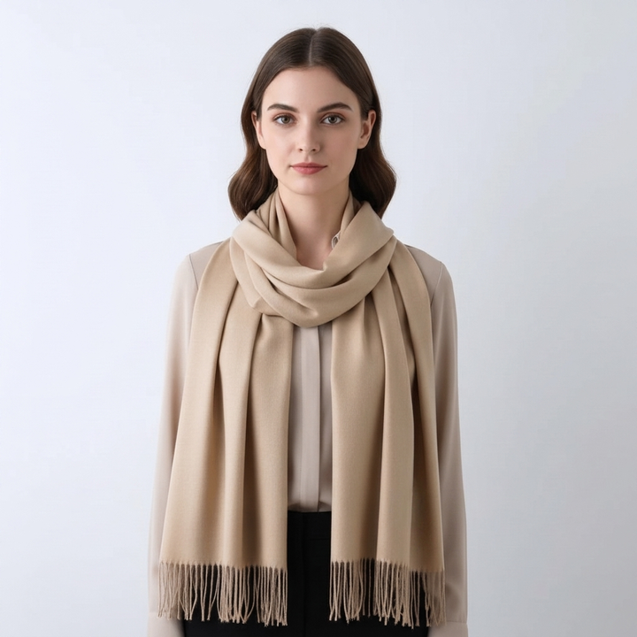 Versatile women's solid winter scarf, perfect for layering; features chic tassel trim & warmth.