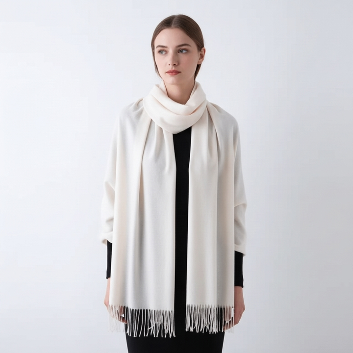 Soft, warm women's solid winter scarf, a cozy accessory with fashionable tassel trim.