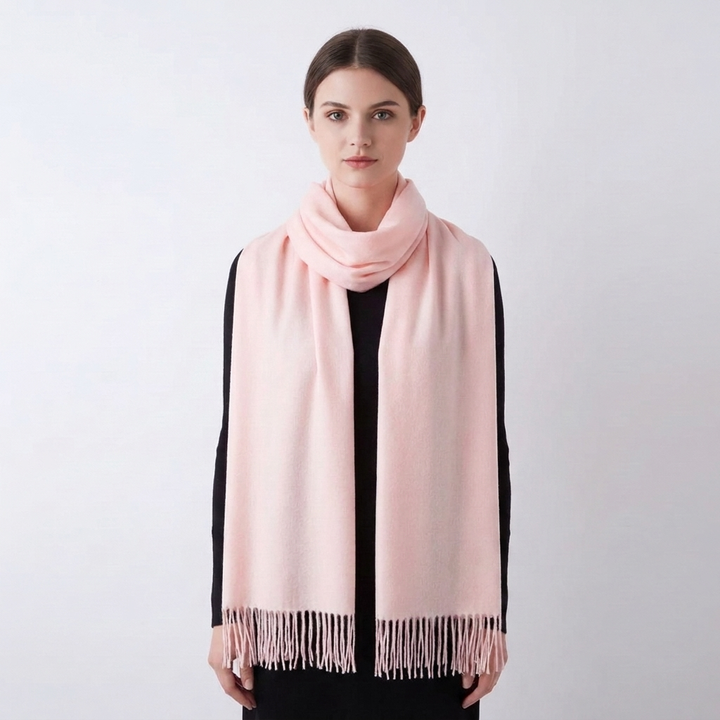 Chic women's solid winter scarf, a trendy fashion accessory with stylish tassel details.