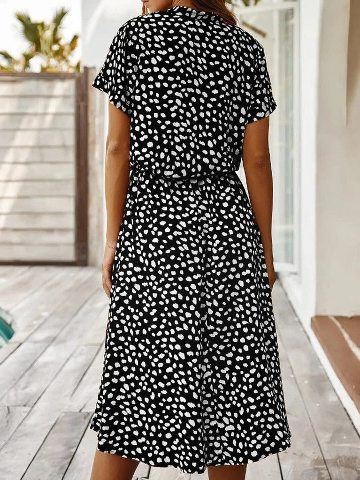 Fashionable women's collared midi shirt dress, spot print, with a flattering gathered waist detail.