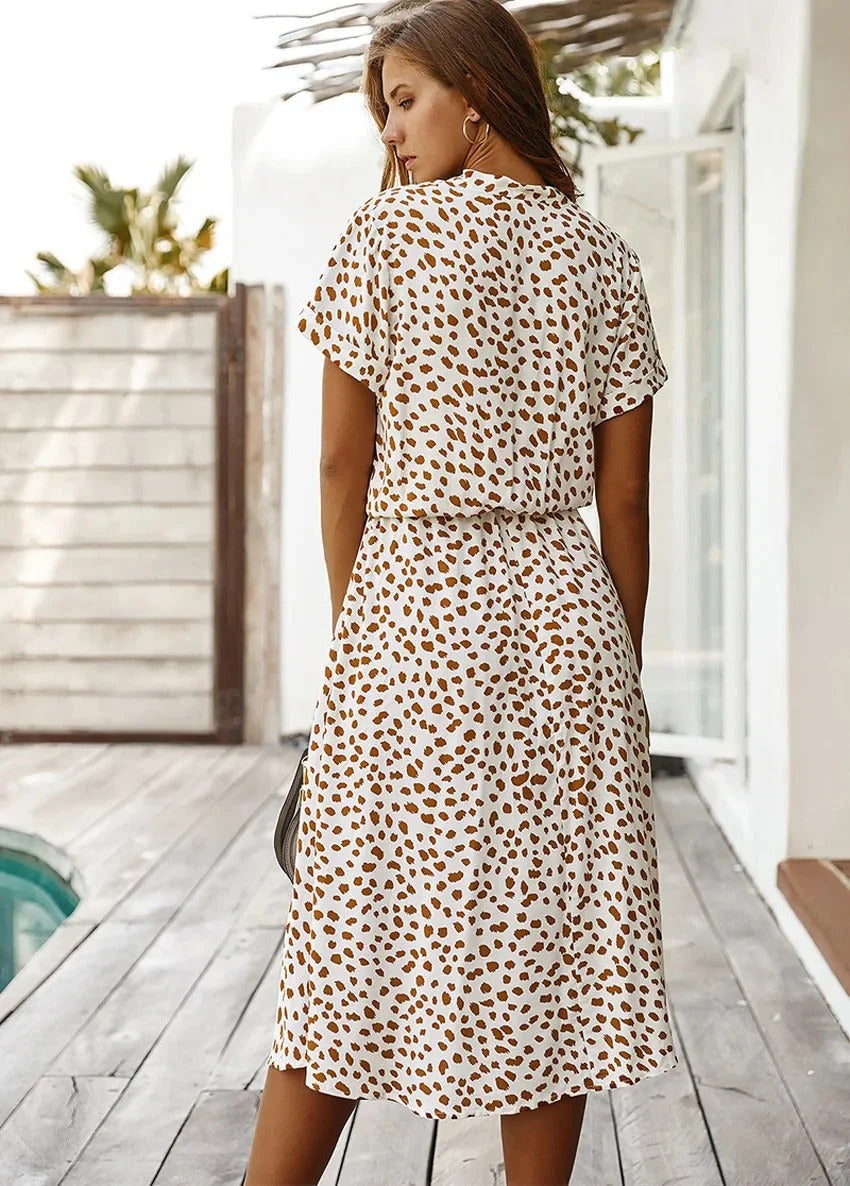 Elegant women's midi shirt dress with classic spot print, collared neckline, perfect for spring.