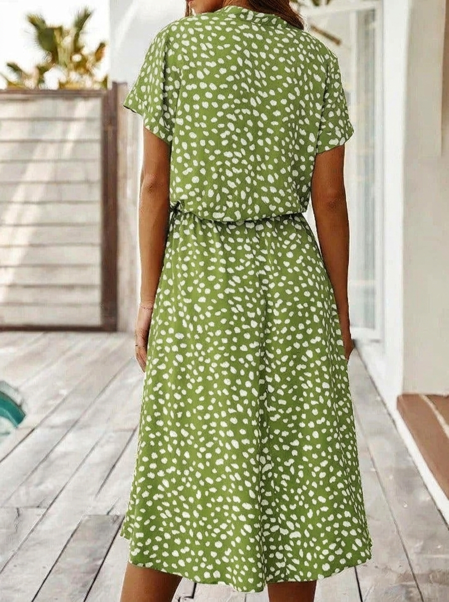 Sophisticated women's collared midi shirt dress featuring a stylish spot print and gathered waist.