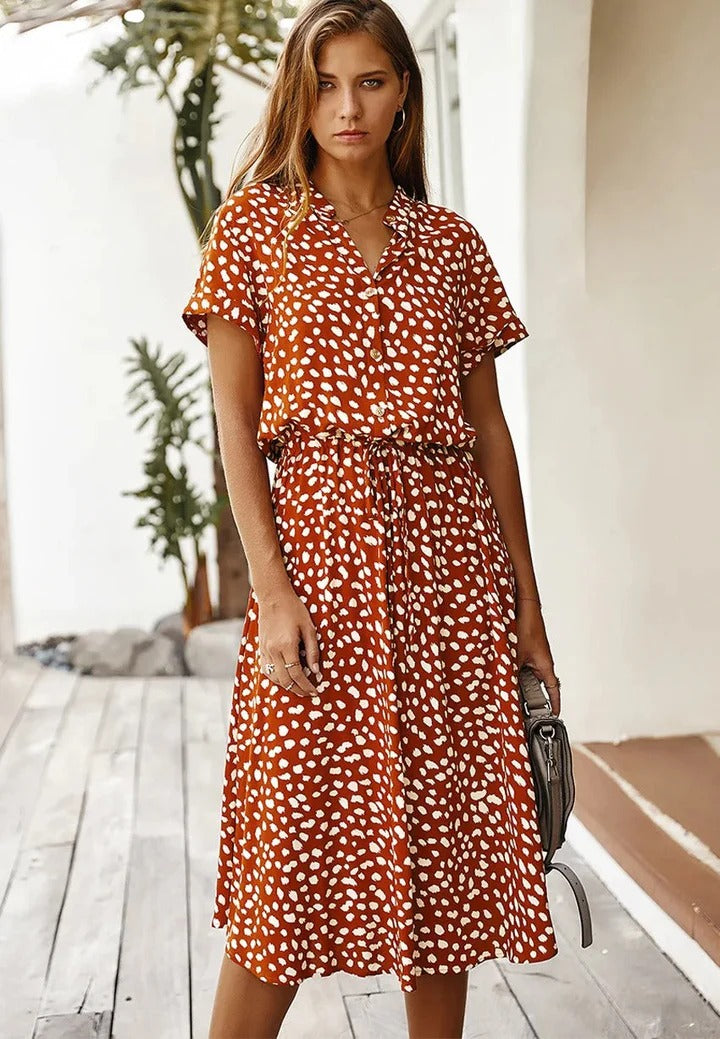 Women's polka dot midi shirt dress with a collared neck, comfortable and versatile for everyday wear.