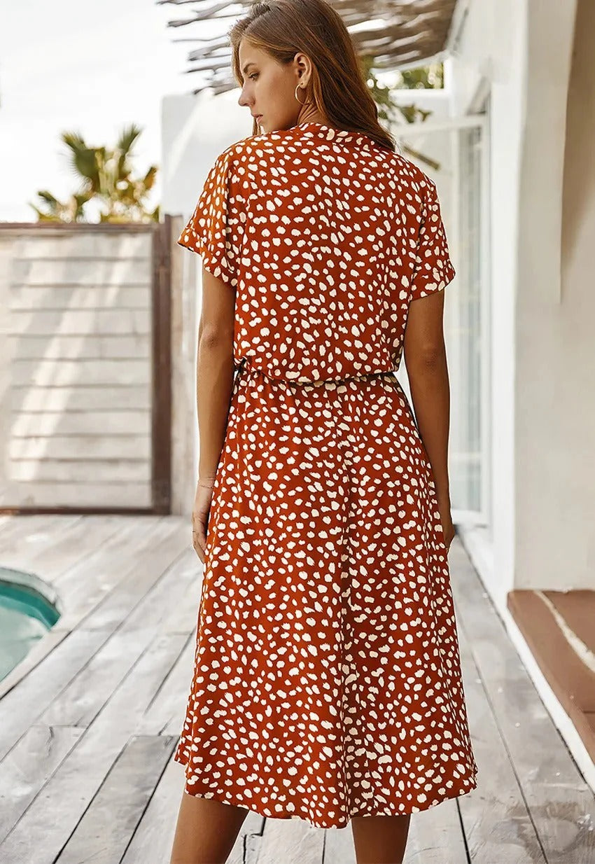 Versatile women's spot print midi shirt dress, collared, suitable for day or evening events.