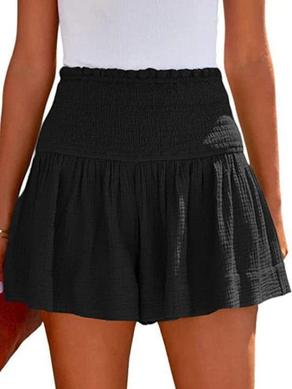 Stylish women's high-waisted smocked shorts, perfect for a chic and relaxed summer outfit.