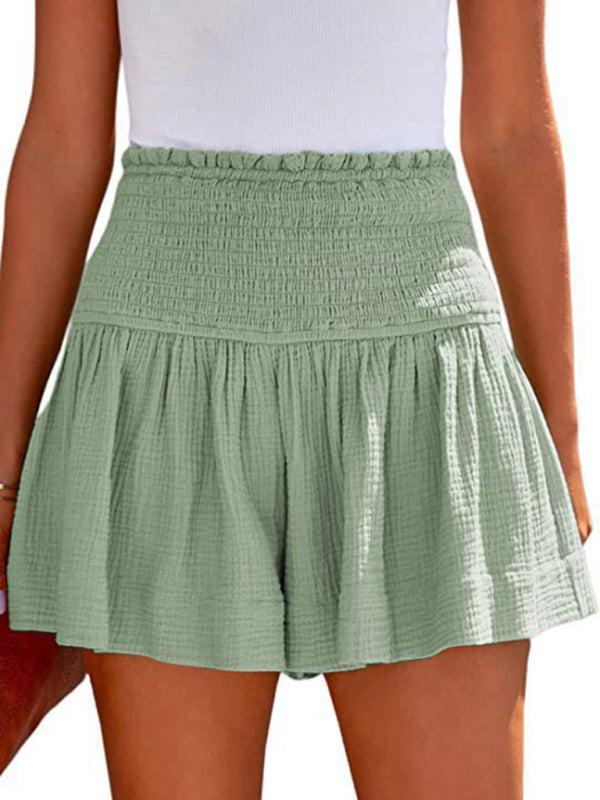 Effortless women's shorts with a high-waisted smocked detail, versatile for summer casual wear.
