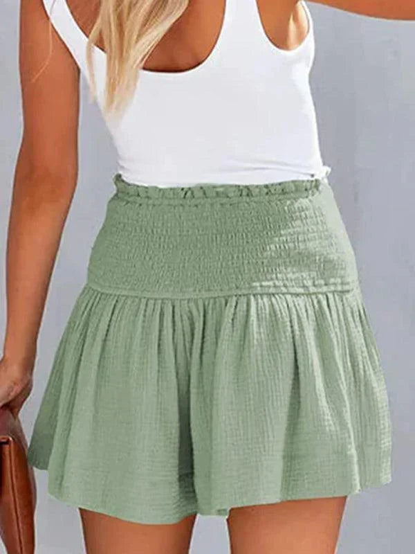 Soft women's smocked waist shorts, high-waisted design for ultimate comfort and summer fashion.