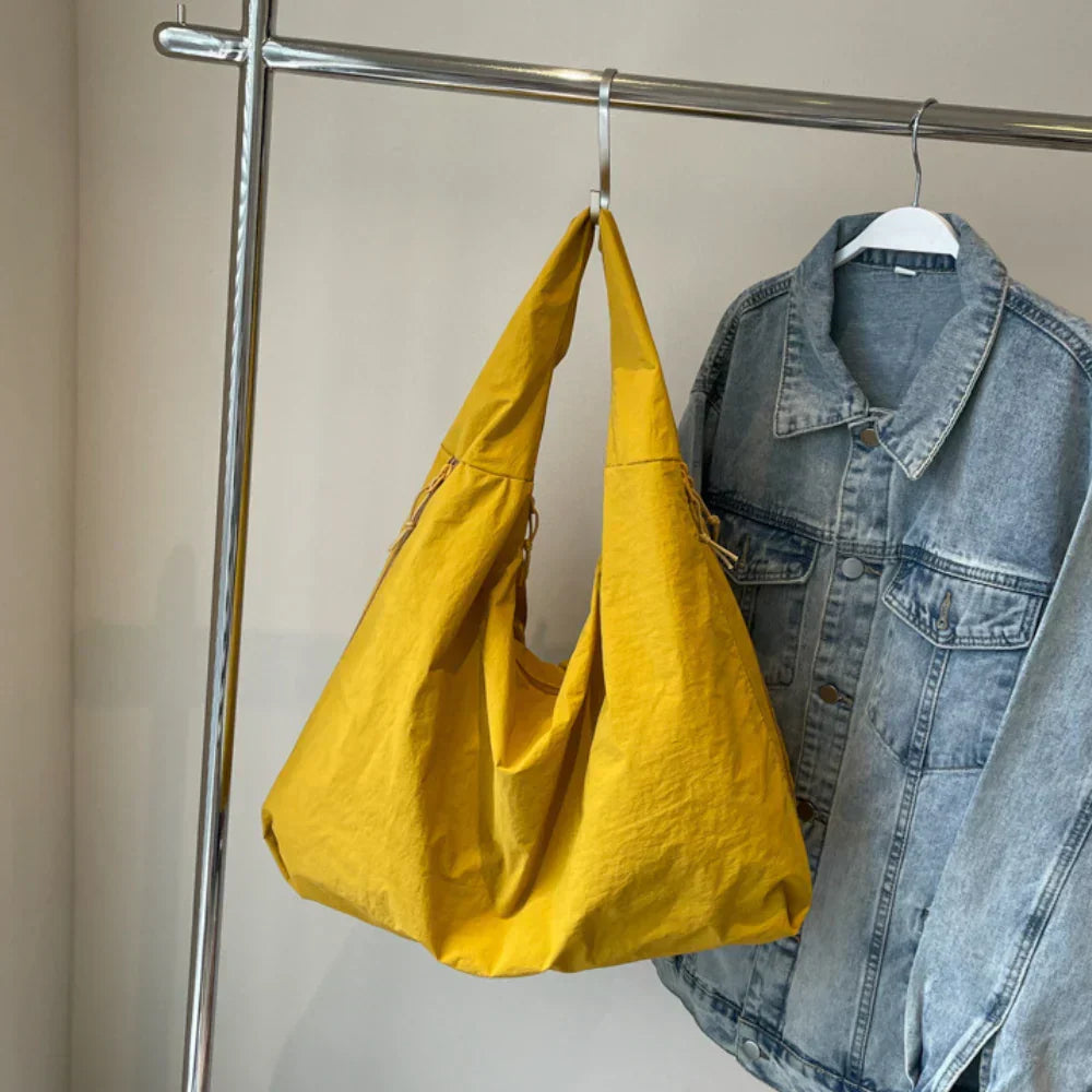 Red everyday hobo bag for women, offering spaciousness and a comfortable slouchy design.
