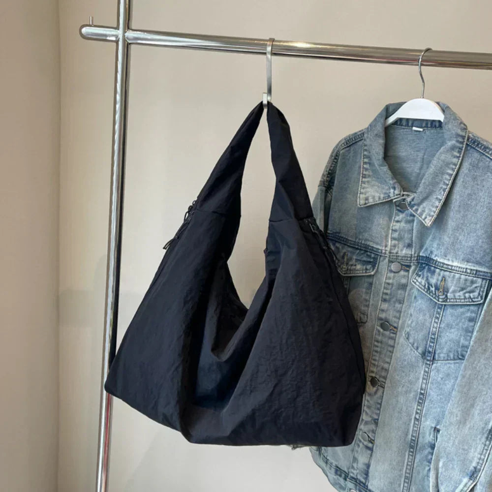 Women's versatile black slouchy hobo bag with spacious capacity for daily essentials.