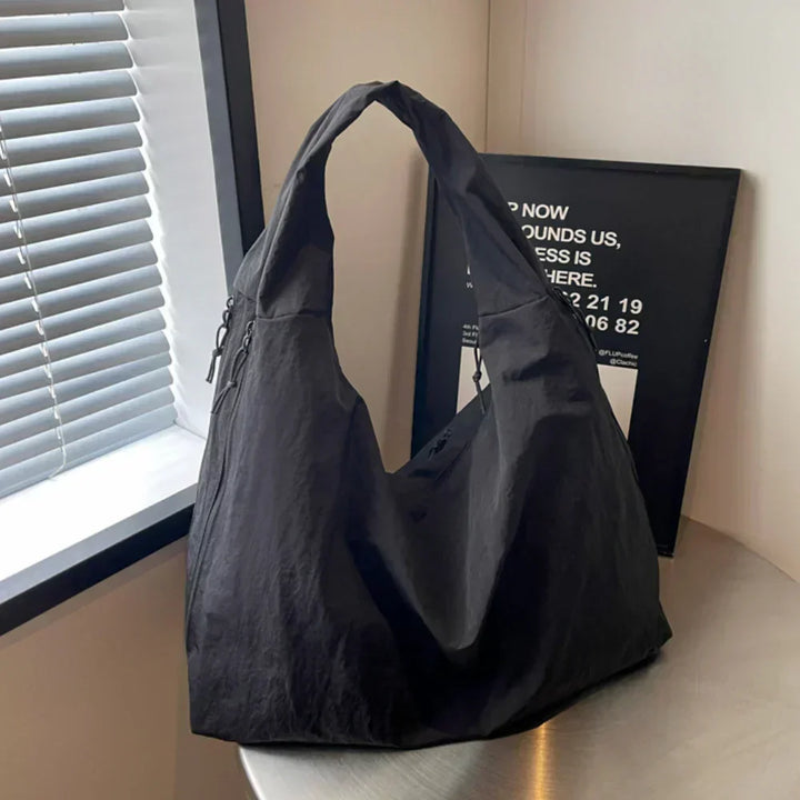Comfortable grey large hobo shoulder bag, a casual fashion accessory for ladies.