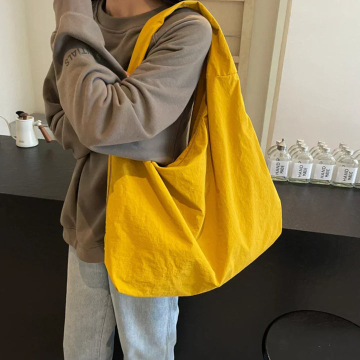 Grey women's hobo bag, comfortable and large, perfect for casual everyday fashion.