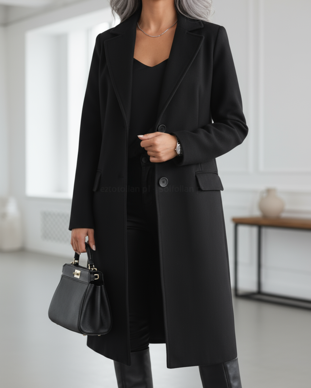 Classic women's long trench coat featuring a notched lapel. Elegant single-breasted outerwear, perfect for fall fashion.