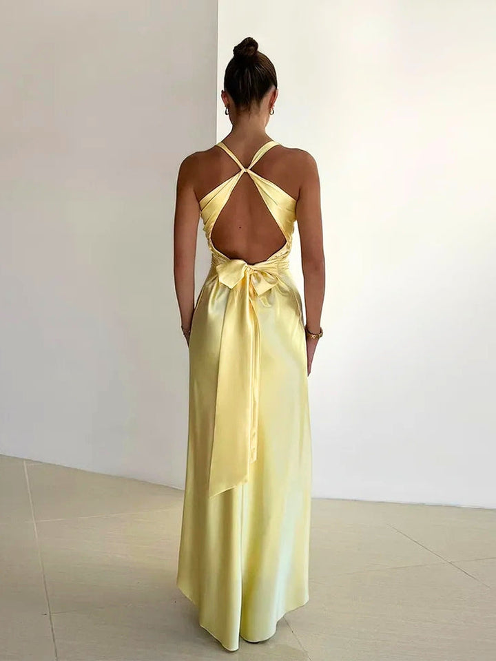 Yellow elegant sleeveless maxi cocktail dress for women with a charming bow back. Ideal for parties.