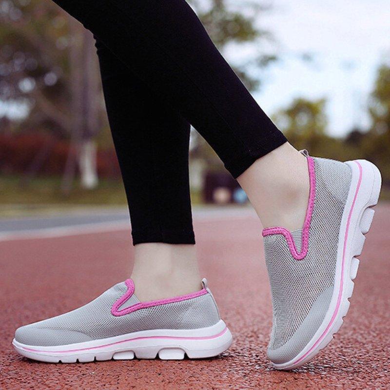 Everyday women's slip-on sneakers featuring a wide toe & cushioned comfort.