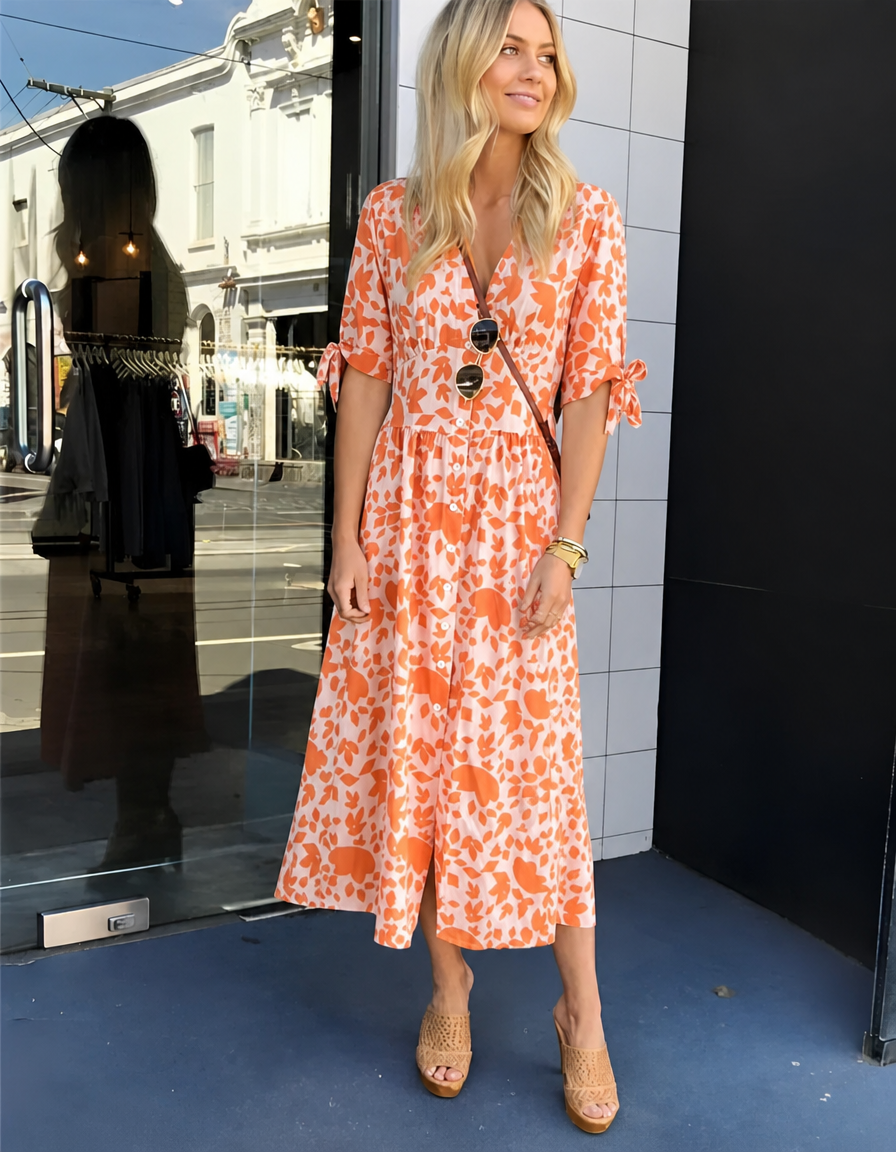 Elegant women's floral button-front midi dress in orange, ideal for spring, summer, casual wear, or vacation.