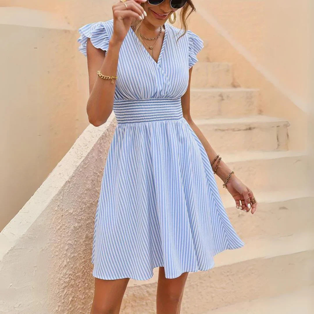Stylish women's striped V-neck spring mini dress, a versatile sleeveless A-line design for casual summer fashion.