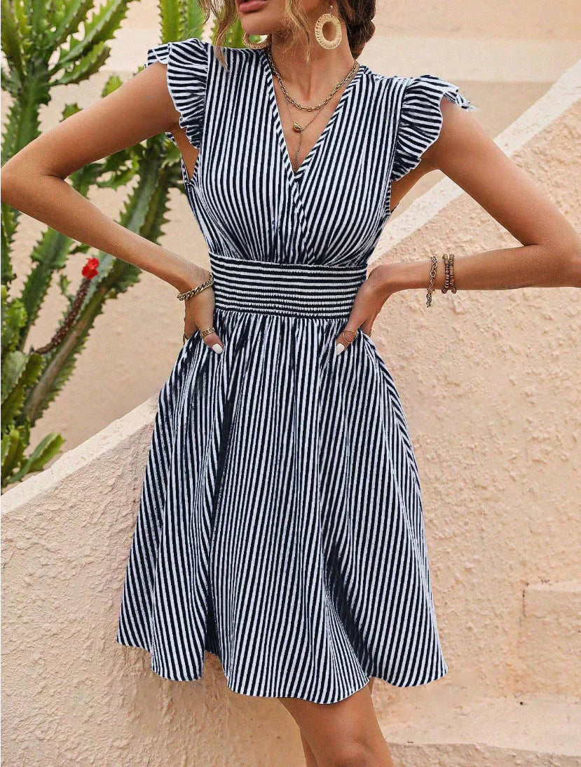 Women's striped V-neck mini dress for spring, featuring a sleeveless and flowy A-line design. Perfect for casual summer style.