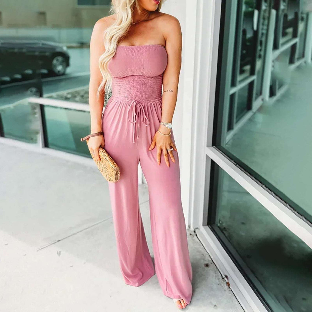 Comfortable women's strapless wide-leg jumpsuit with a flattering tie waist and functional pockets for all seasons.