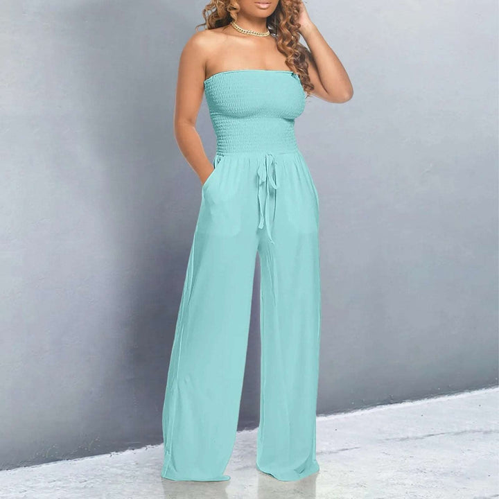Fashionable women's sleeveless strapless wide-leg jumpsuit, complete with an adjustable tie waist and useful pockets.