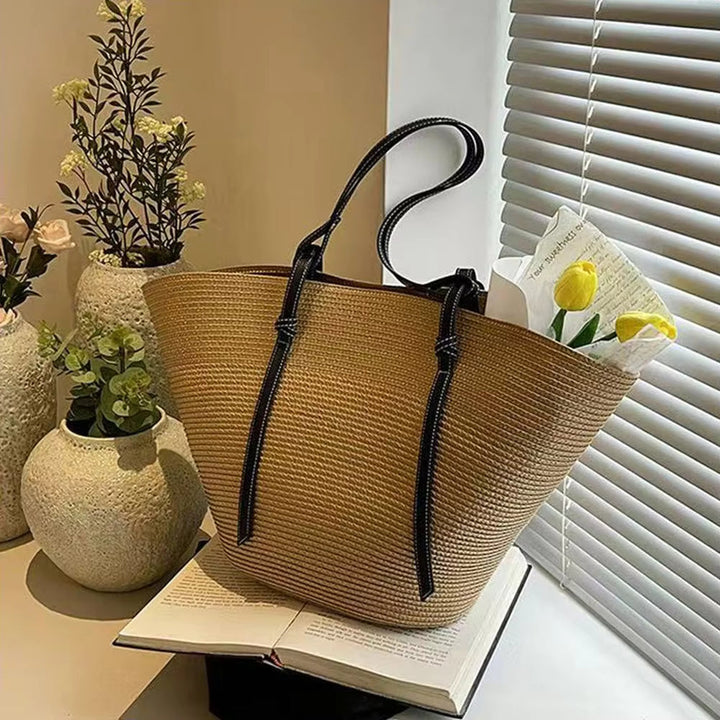Khaki women's woven beach tote bag with a spacious shopper style, perfect for summer outings.