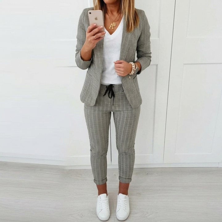 Stylish women's plaid two-piece suit featuring a smart blazer and comfortable cropped pants.