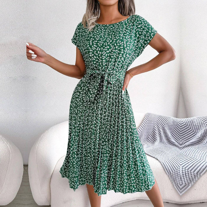 Casual elegant women's midi summer dress with vibrant floral print and flattering pleated tie waist.