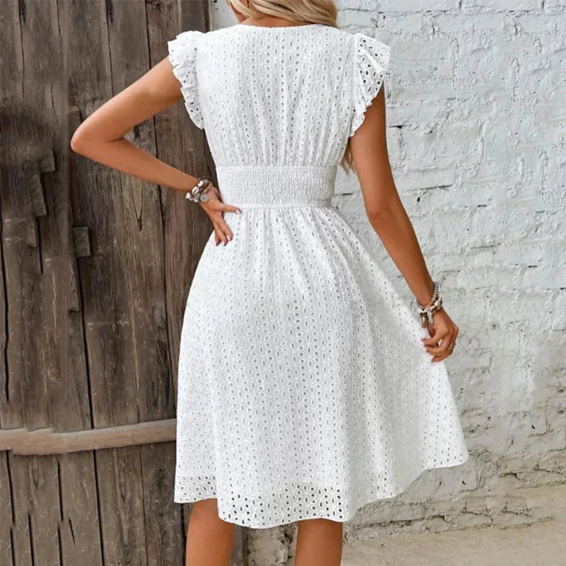 Casual women's flowy eyelet midi dress with V-neck & smocked waist, ideal for summer vacation or beach.