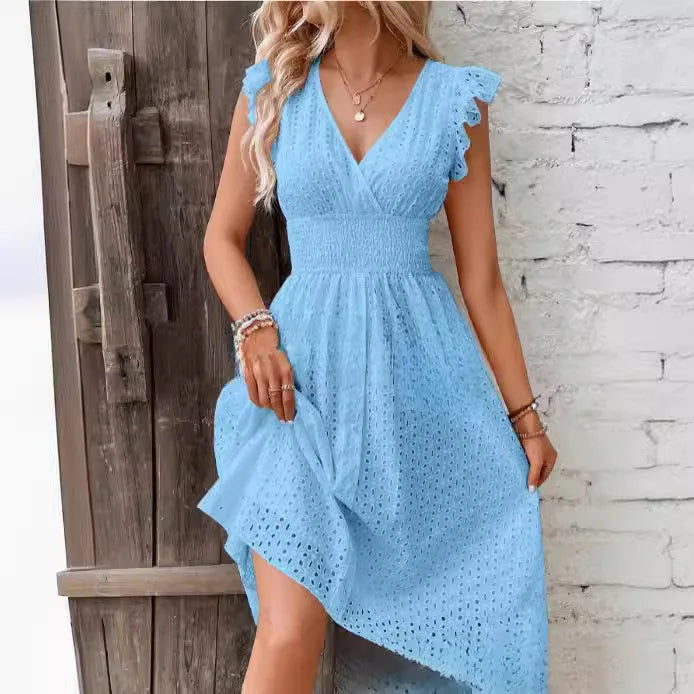 Detailed eyelet V-neck midi dress for women. Flowy summer design with smocked waist & ruffled sleeves for comfort.