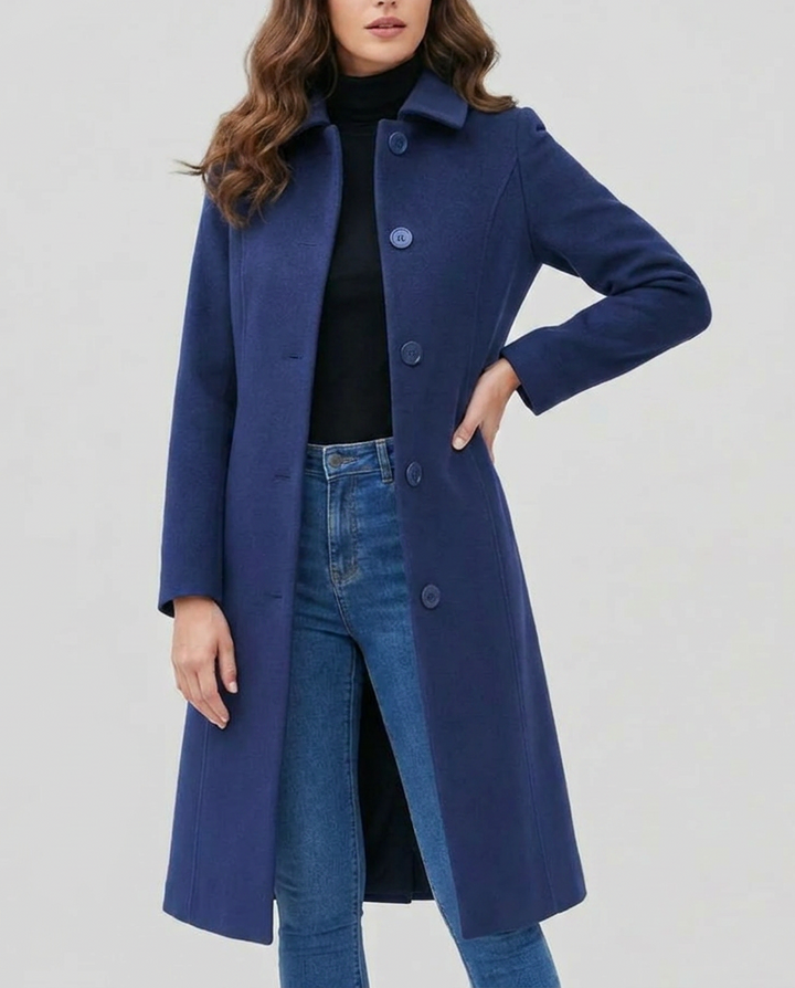 Model wearing an elegant long women's trench coat, single-breasted, perfect for classic style and fall outerwear.