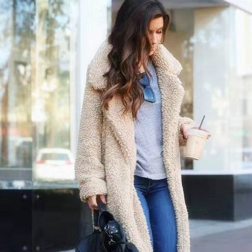 Womens trendy long teddy coat Isla in warm faux fur for winter fashion.