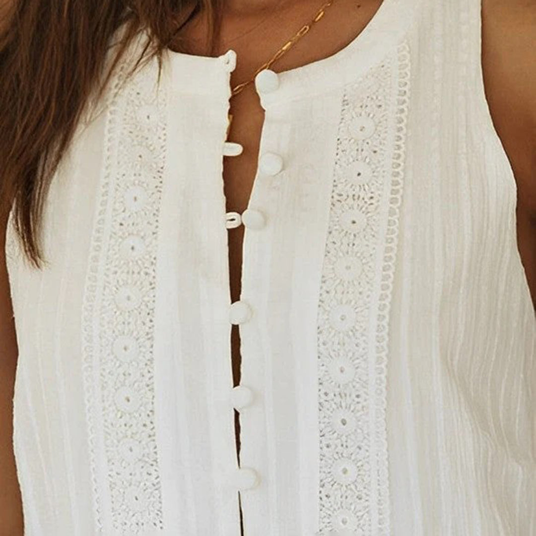 Women's tiered white boho mini dress with eyelet details and a button placket, a chic and flowy summer vacation dress.