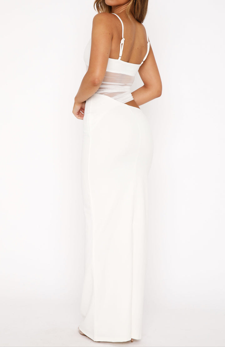 Women's elegant white column maxi dress with a sophisticated sheer waist cutout for formal evenings.