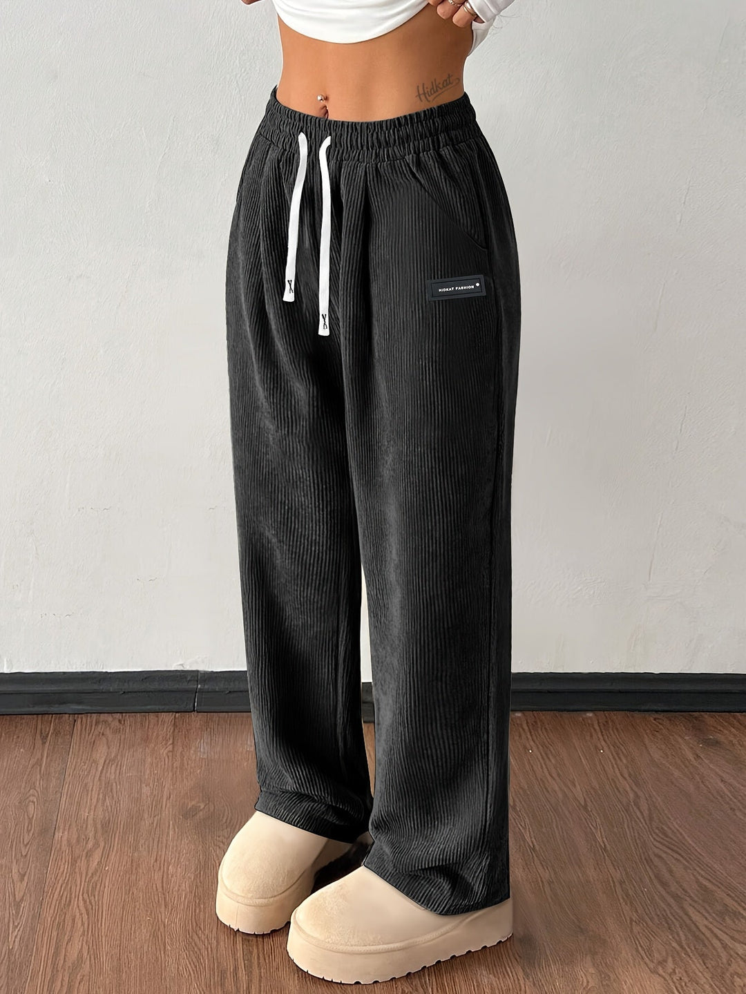 Woman wearing comfortable baggy wide leg corduroy pants with pockets for a stylish, relaxed casual look.