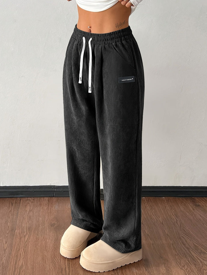 Woman wearing comfortable baggy wide leg corduroy pants with pockets for a stylish, relaxed casual look.