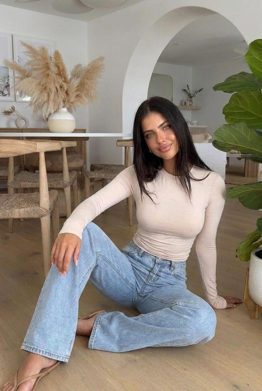 Mid-rise blue wide leg jeans for women. Relaxed fit denim, ideal for versatile all-season casual wear.