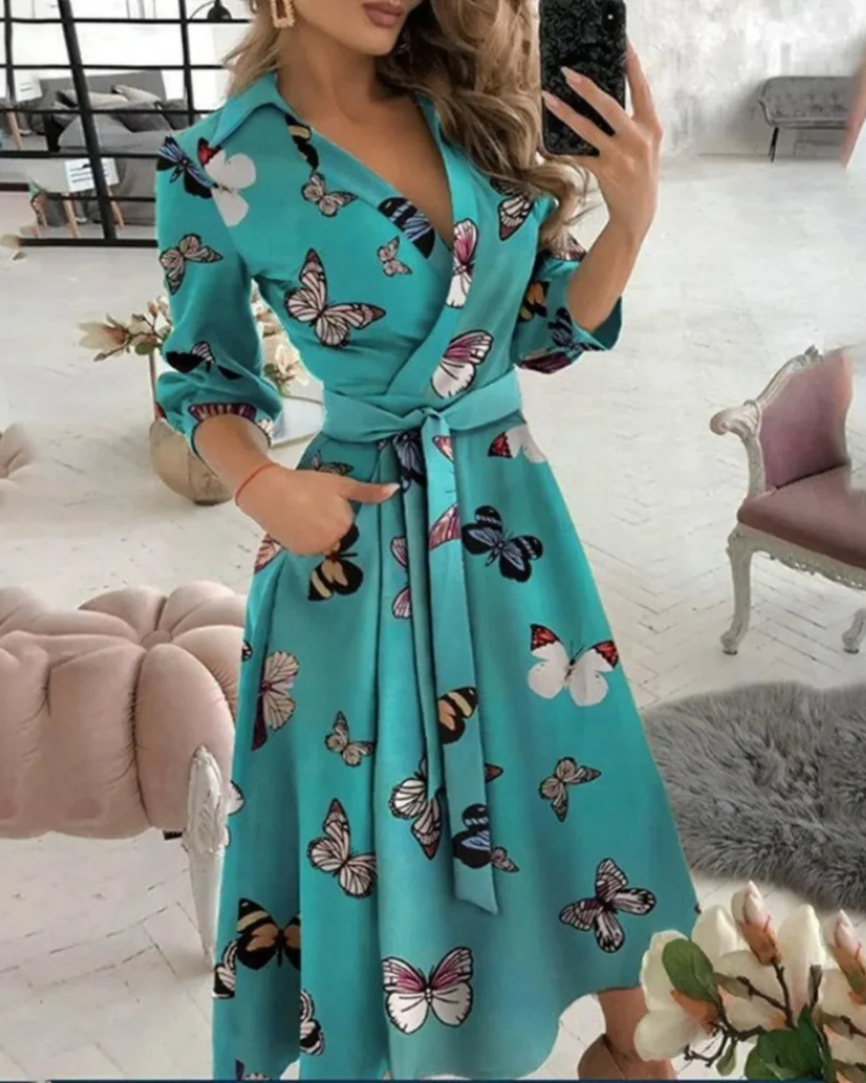 Sophisticated women's wrap work dress, midi length with adjustable tie waist, ideal elegant professional attire.