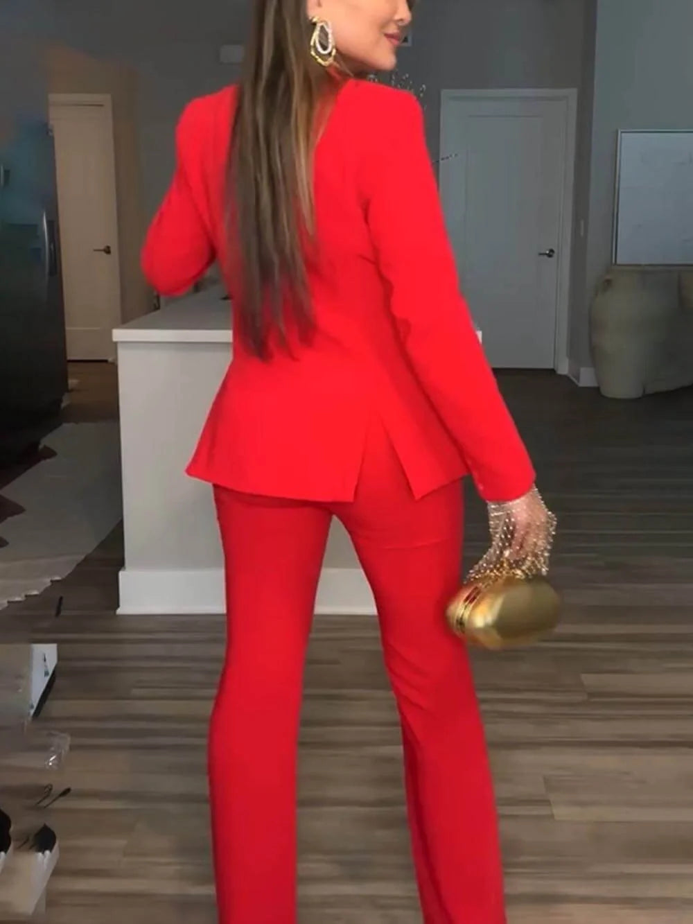 Professional women's power suit blazer and trouser set in a stylish design for sophisticated office wear.
