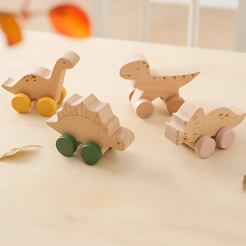 Set of 4 vibrant wooden dinosaur roller cars, perfect for toddlers. Durable kids' toys for imaginative and motor skill play.