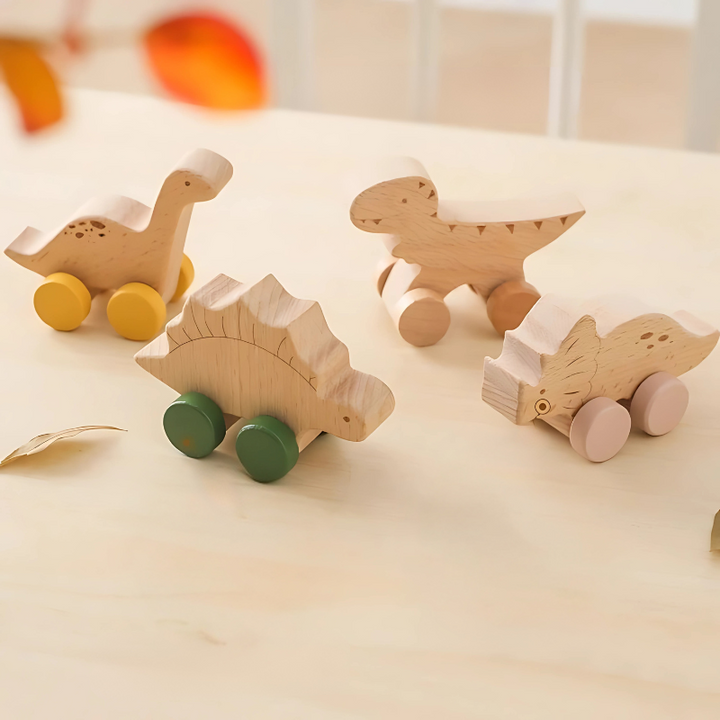 Set of 4 vibrant wooden dinosaur roller cars, perfect for toddlers. Durable kids' toys for imaginative and motor skill play.