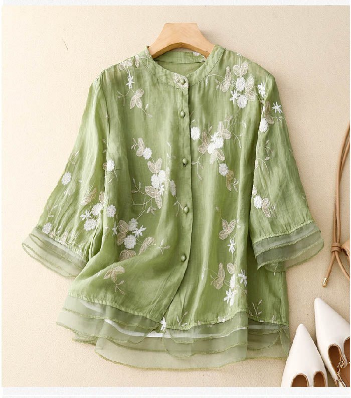 Chic women's embroidered blouse with delicate floral patterns, perfect for elegant daily wear.